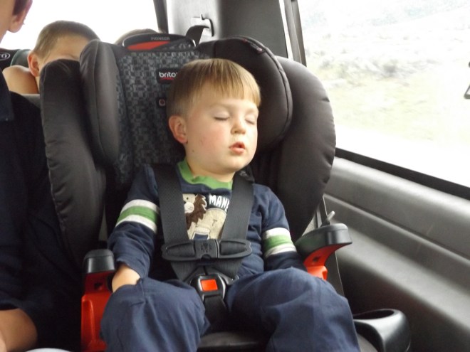 Damien sleeping with his hands in his pockets.