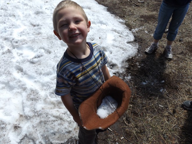 Dominic decided to load his hat up with snow.
