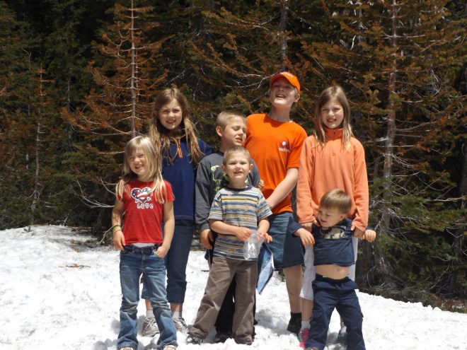 The kids enjoying some of the snow at Crater Lake.