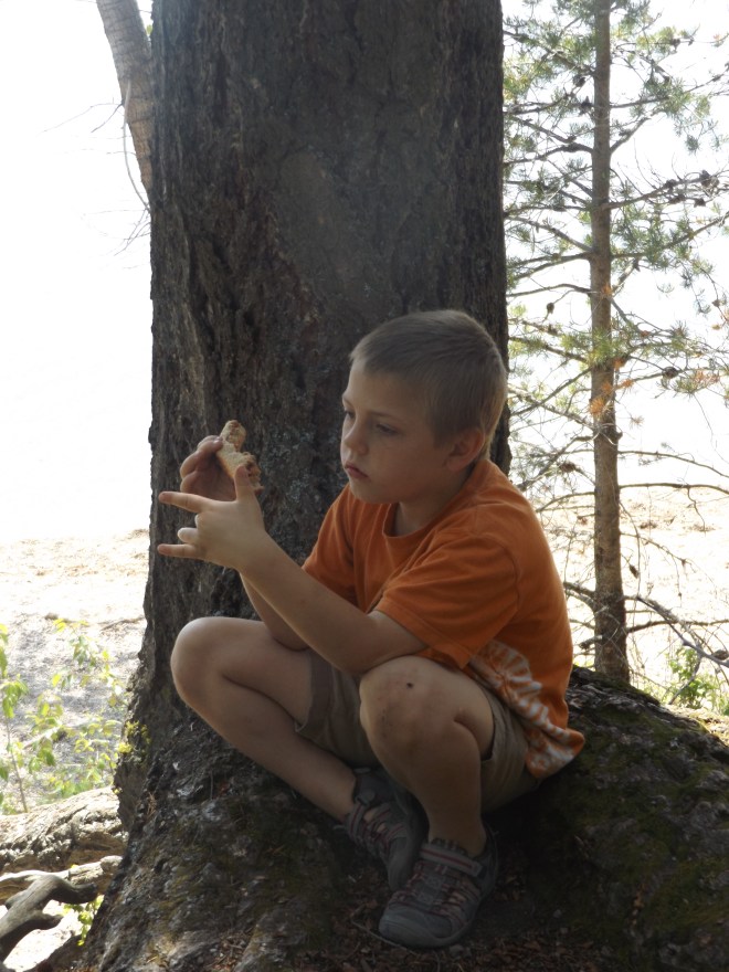 Isaac lost in thought over a peanut butter and jelly sandwich.
