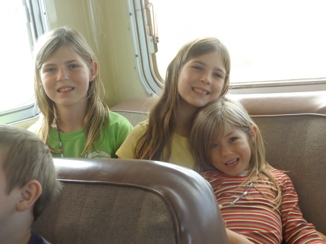 Alex, Annette, and Amelia on the bus