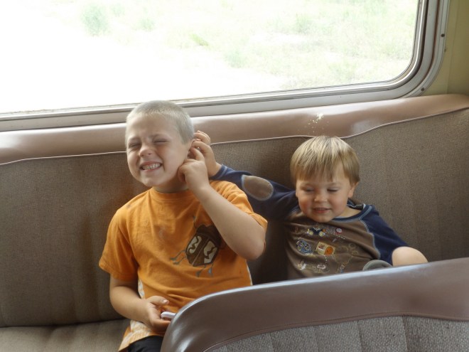 Isaac and Damien on the bus (pinching has been Damien's favorite pastime on this trip!)