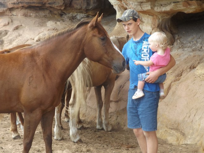Ryon and AnaClaire. She was so excited about seeing the horses, but a little nervous about being close to one