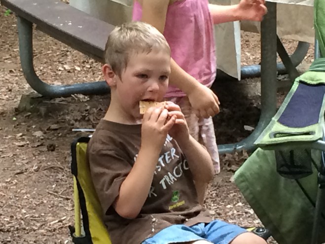 Dominic eating a s'more